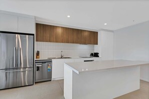 Fridge, microwave, oven, stovetop - The Corso - Central Maroochydore Apartment (Sunshine Coast)
