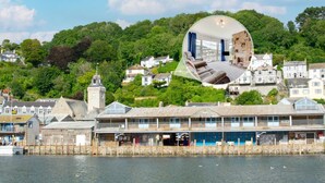 A coastal town with a prominent pier, a clock tower, and a residential area with houses. - 2 Bed in Looe (oc-mizzen) (Looe)