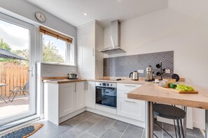 Microwave, oven, cookware/dishes/utensils - 2 Bed in Talwrn (oc-wai228) (Ysgubor Hen)