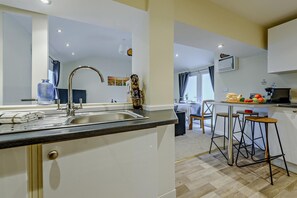 Microwave, oven, high chair, cookware/dishes/utensils