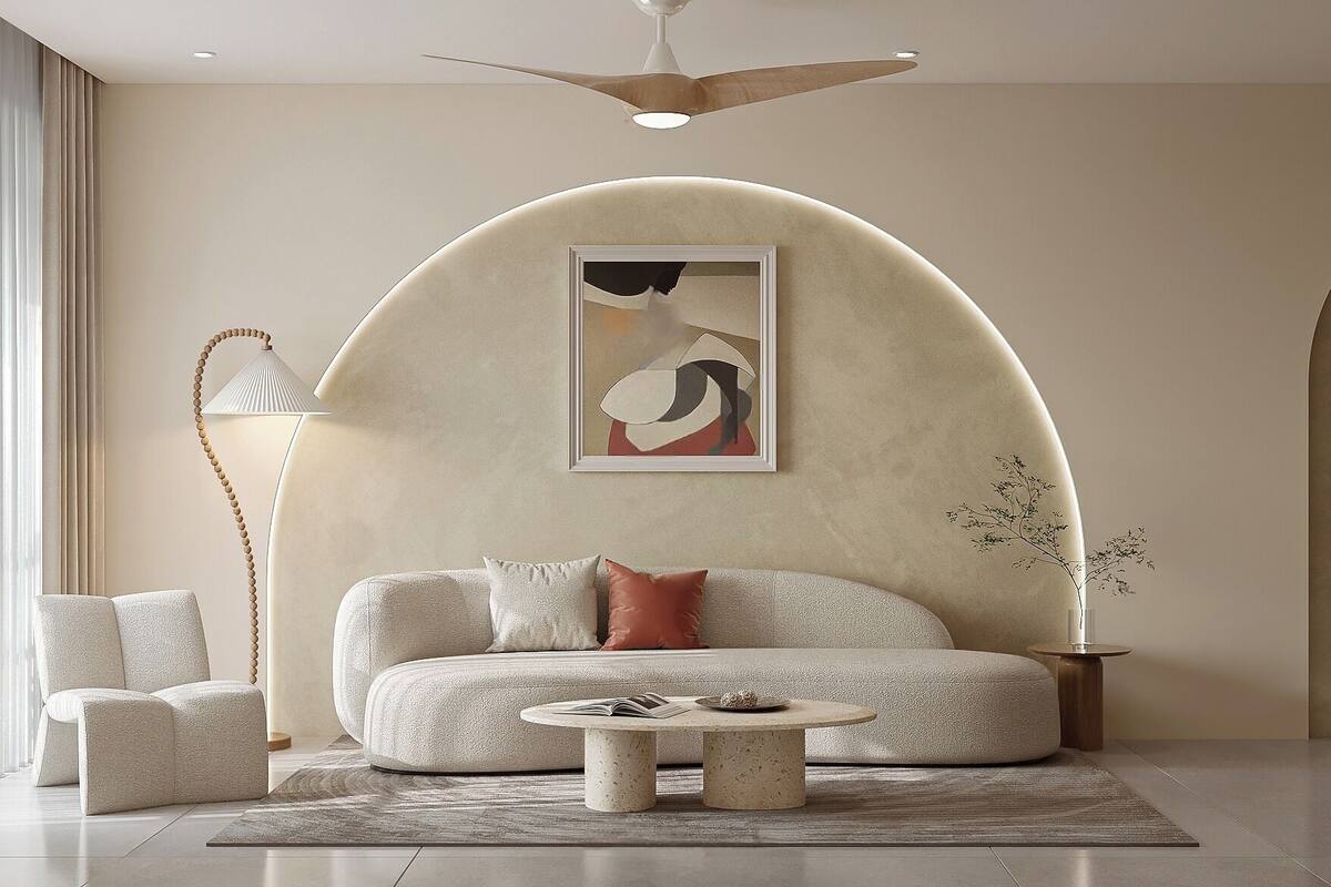 A modern living room with a sofa, a coffee table, and a pendant light.