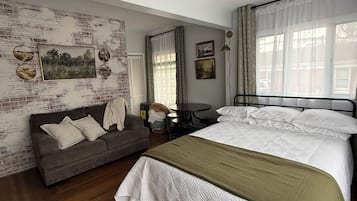 1 bedroom, desk, iron/ironing board, travel crib