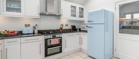 Oven, dishwasher, highchair, cookware/dishes/utensils