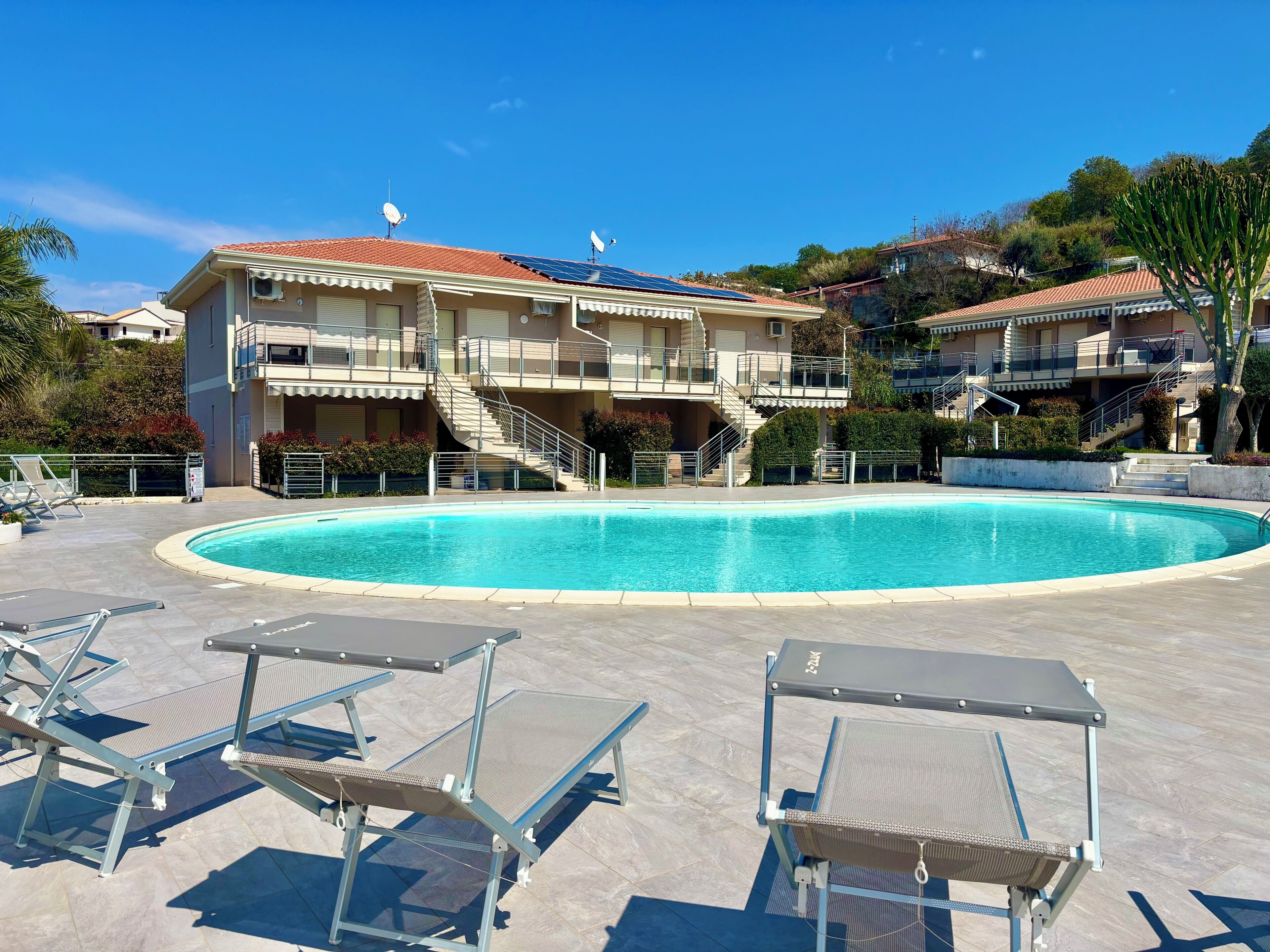 Seasonal outdoor pool, pool umbrellas, pool loungers