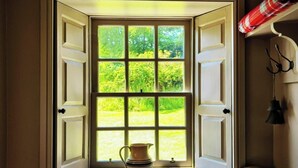 A room with a window open, revealing greenery outside. A pitcher is placed on the windowsill. - 4 Bed in Cardross (oc-t30303) (Cardross)