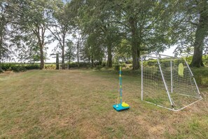 A grassy outdoor area with a goalpost and a netted goal. - 2 Bed in North Tamerton (oc-p30360) (North Tamerton)