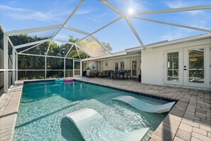 Outdoor pool, a heated pool - Charming Naples Escape: 3BR Home with Heated Pool & Modern Comforts (Naples)