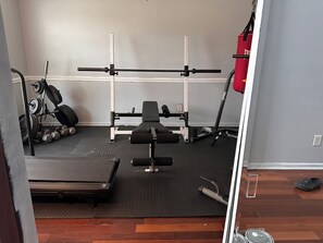 Fitness facility - Spacious 6-bedroom charming home with AC and fitness room, and sauna. (Douglasville)