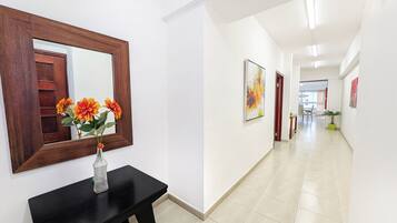 Family Apartment, City View | Living area | Flat-screen TV