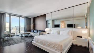 Deluxe Studio Suite, City View | Premium bedding, in-room safe, blackout drapes, iron/ironing board