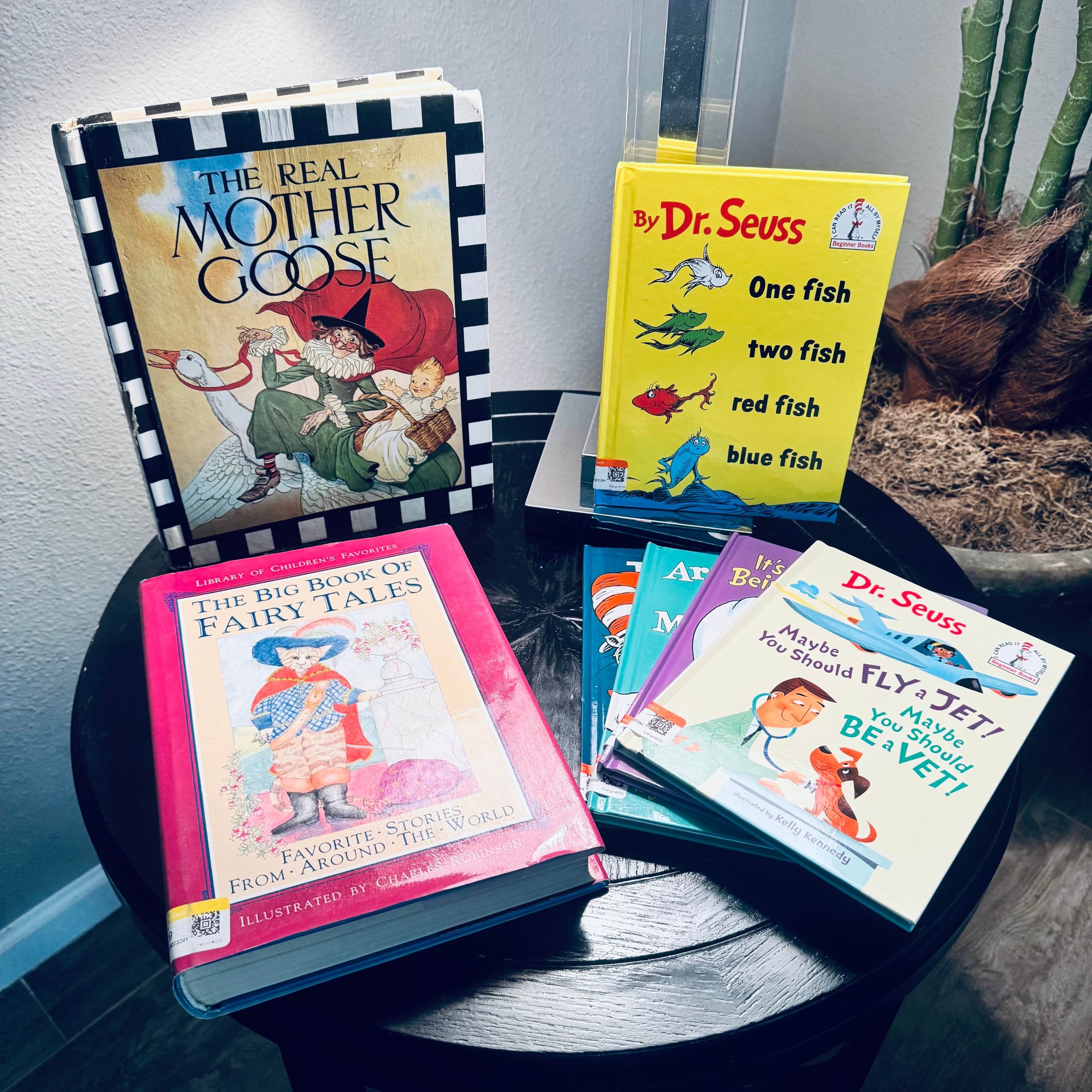A collection of children's books on a table.