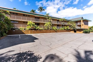 A multi-story motel with a parking lot in front. - Kalama Terrace P-307 - 3rd-floor Walkup, 7 min Walk to Charley Young Beach, AC! (Kihei)