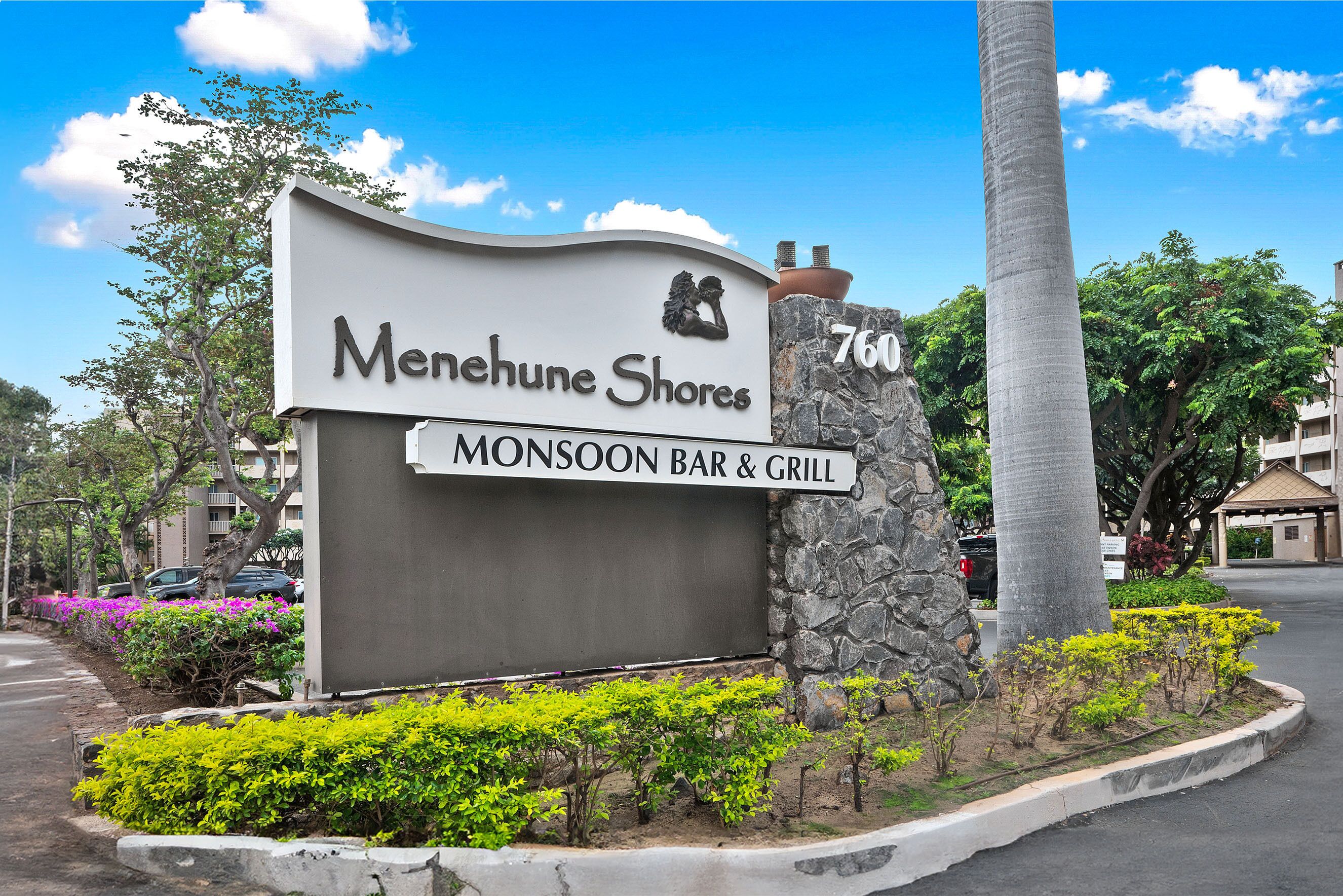 A sign for Meneanhe Shores with a Monsoon Bar & Grill.