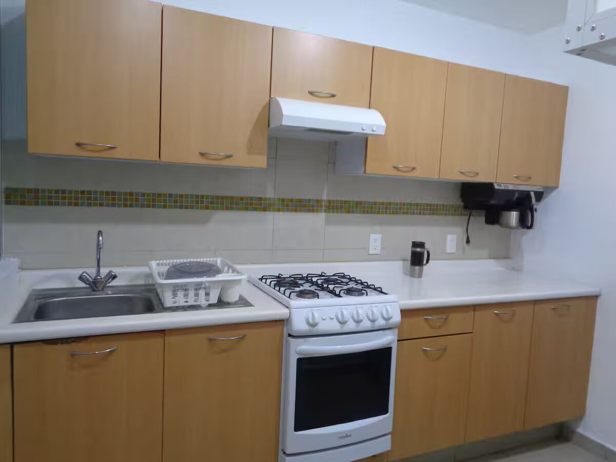 Fridge, microwave, coffee/tea maker, cookware/dishes/utensils