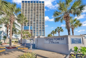 A gated entrance to Ocean Forest Plaza with a sign indicating it is a privately owned condominium. - Newly Renovated Luxury Oceanfront 15th‑Floor Condo Only Steps from Beach (Myrtle Beach)