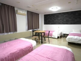 Economy Quadruple Room, City View | Desk, free WiFi, bed sheets