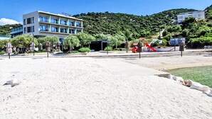 A beachside hotel with a modern design, a pool, and a playground. - Wohnung in Marina mit Parkplatz, schöne Aussicht by Interhome (Marina)