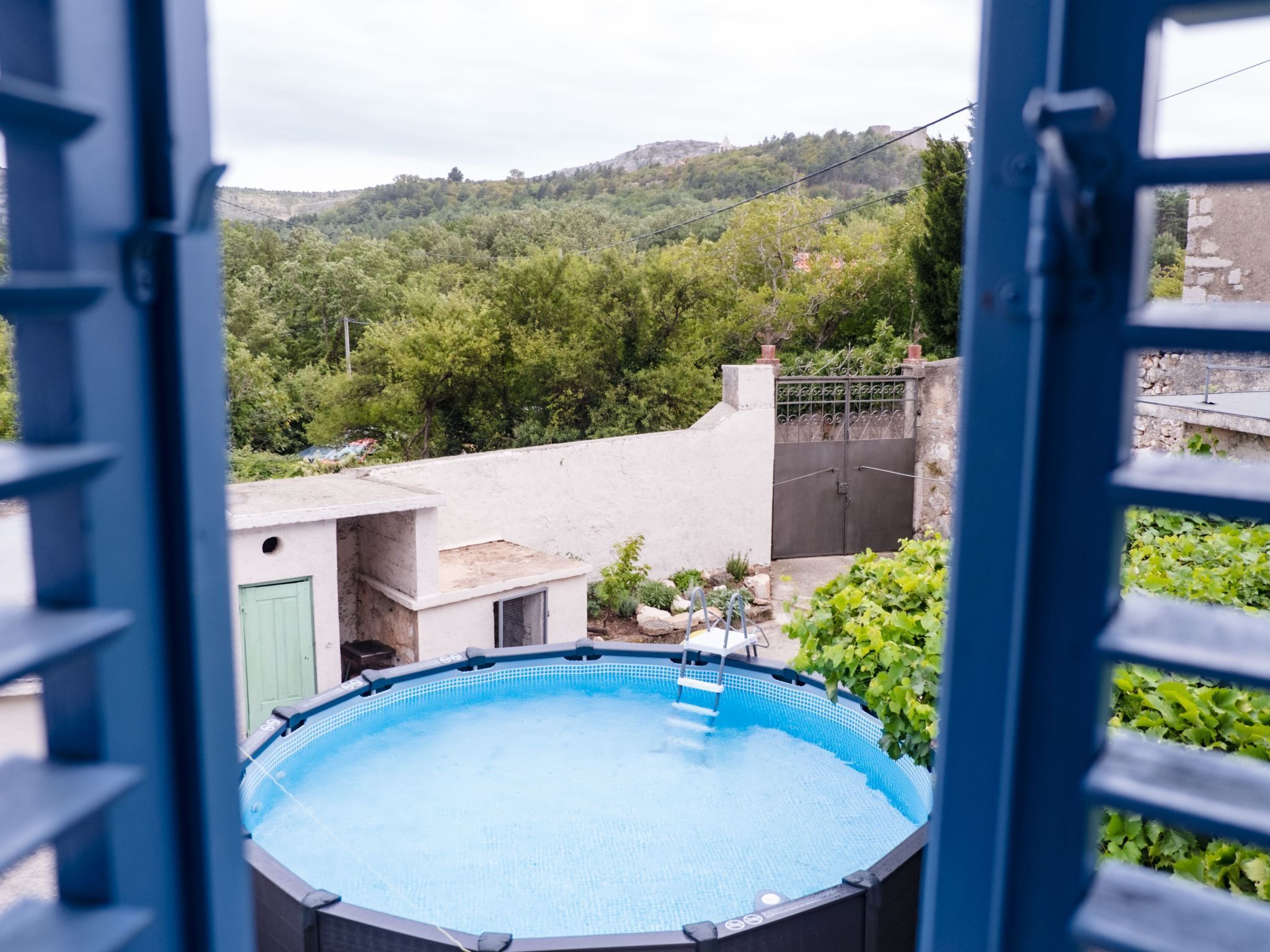 A view of a swimming pool with a clear sky and greenery in the background. - Mediterranes Haus mit privatem Garten und Pool by Interhome (Drivenik)