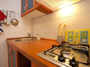 Fridge, microwave, cookware/dishes/utensils