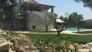 A two-story stone house with a swimming pool in the backyard. - Villa Miramar by Interhome (Poreč/Tar)