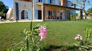 A two-story house with a stone facade, blue shutters, and a tiled roof. - Villa Miramar by Interhome (Poreč/Tar)