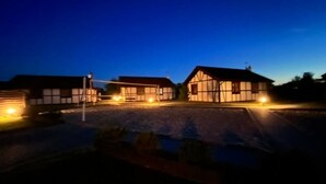 A traditional building with a symmetrical facade, large windows, and a central entrance. - "Dom4" mit Wasserblick by Interhome (Sarbinowo)