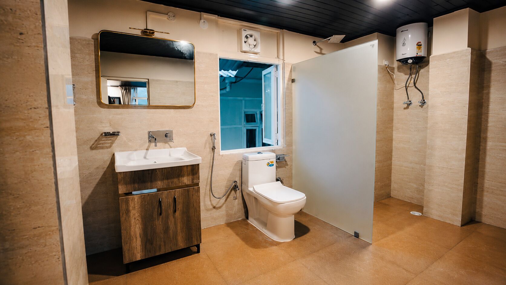 A bathroom with a toilet, sink, and shower.
