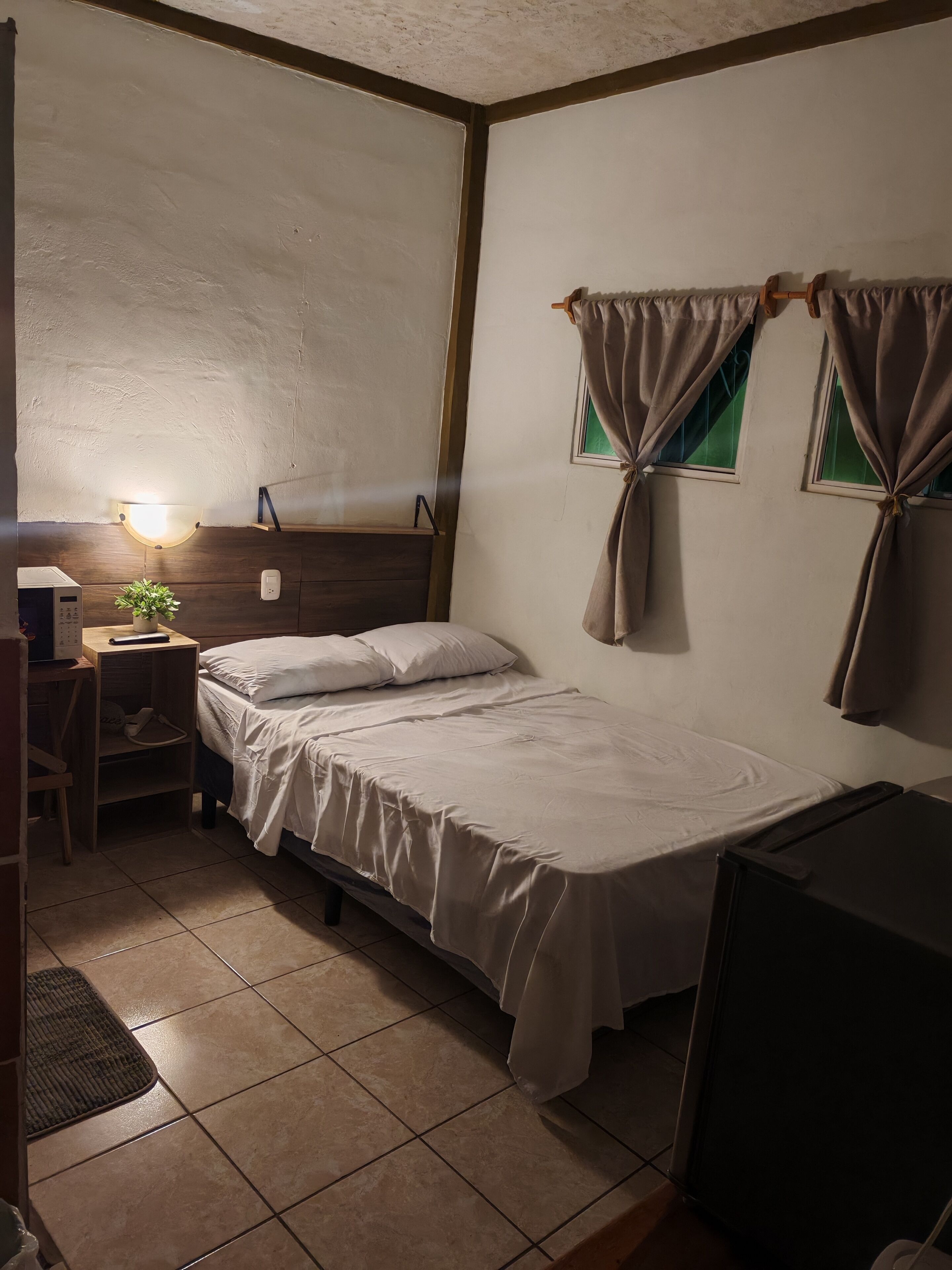 Economy Single Room, Patio | Down duvets, minibar, laptop workspace, free WiFi