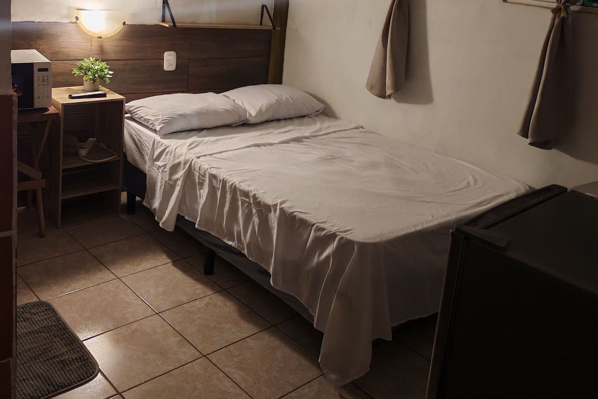 Economy Single Room, Patio | Down comforters, minibar, laptop workspace, free WiFi