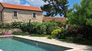 A swimming pool with a stone house in the background. - Wohnung "Eti and Mia 3" mit Pool by Interhome (Pula/Banjole)