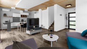 A modern living space with a kitchen, dining area, and seating area. - in Dračevac mit Großem Pool by Interhome (Dracevac)