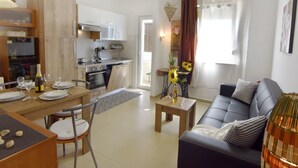 A modern apartment with a kitchen, dining area, and living room. - Martina B4 by Interhome (Umag)