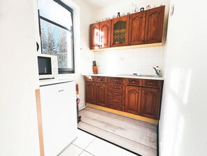 Fridge, microwave, cookware/dishes/utensils