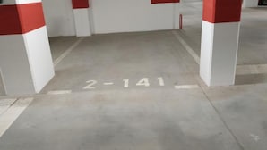 A parking garage entrance with white pillars and red stripes, and a floor marked with "2-141". - Comfort Apartment Baruna Filipovića (Zagreb)
