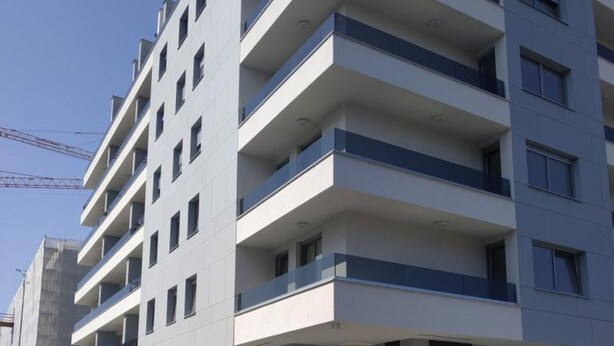 A multi-story building with balconies, large windows, and a modern architectural design. - Comfort Apartment Baruna Filipovića (Zagreb)