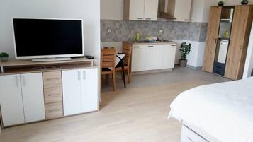 Studio (Studio Apartment With Balcony) | Living room | 32-inch flat-screen TV with satellite channels