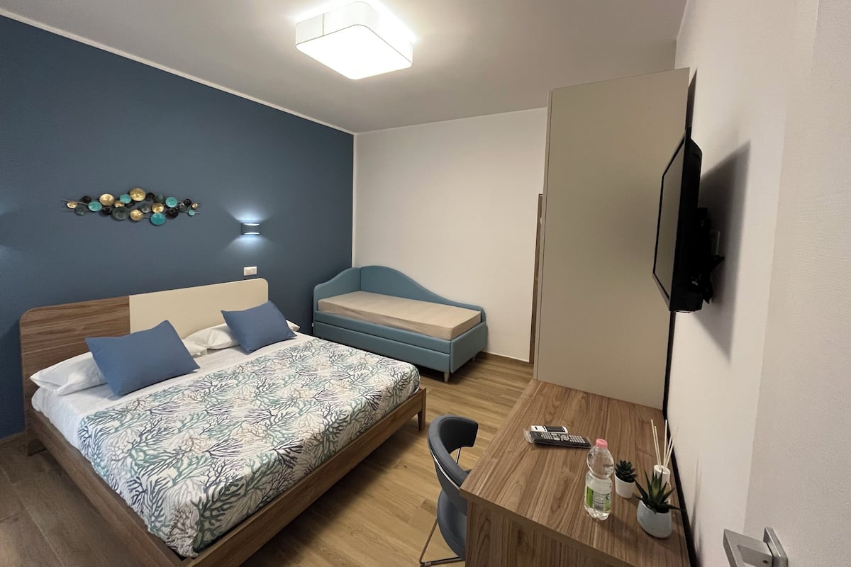 Standard Quadruple Room, Balcony, City View | In-room safe, blackout drapes, free WiFi