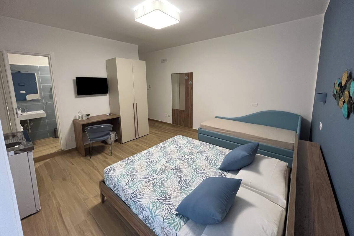 Superior vierpersoonskamer | Een kluis op de kamer, verduisterende gordijnen, gratis wifi