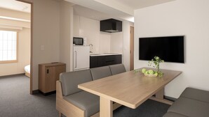 A modern, compact living space with a kitchenette, a dining area, and a seating area. - MIMARU Osaka Namba Station Annex (Opens on October 1, 2026) (Osaka)