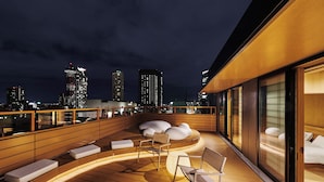 A rooftop terrace with seating and a city skyline view. - MIMARU Osaka Namba Station Annex (Opens on October 1, 2026) (Osaka)