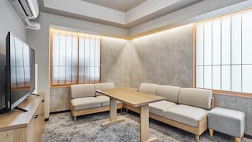 Two-Bedroom Family Apartment | Down comforters, in-room safe, free WiFi, bed sheets