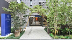 A modern building with a sign for 'Apartment Hotel Mimaru Osaka Shinsaibashi Central'. - MIMARU Osaka Shinsaibashi Central (Opens on September 1, 2026) (Osaka)