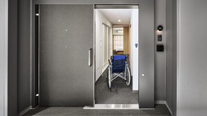An elevator with a wheelchair in the hallway. - MIMARU Osaka Shinsaibashi Central (Opens on September 1, 2026) (Osaka)
