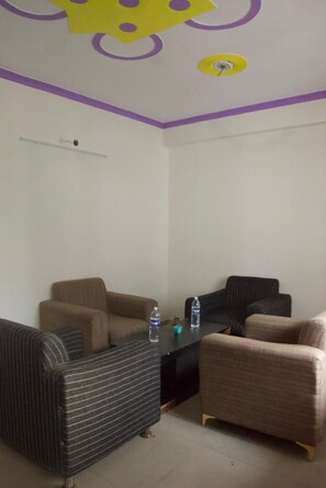 32-inch flat-screen TV with cable channels - Hotel Dark Clouds (Sukha)