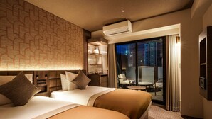 A hotel room with two beds, a large window, a minibar, and a view of the cityscape. - BOUNCEE by RIHGA Fukuoka Hakata (Fukuoka)