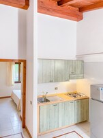 Family Apartment | Private kitchen | Full-size fridge, cookware/dishes/utensils, dining tables
