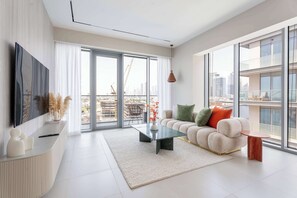 TV - Elegant 3BR + Office | Canal View | Pool & Gym Access (Al Wasl)
