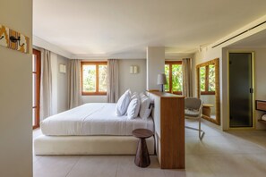 A hotel room with a bed, a desk, a chair, and a mirror. - Gran Hotel Margalida Mallorca by Annua Signature - New Opening (Banyalbufar)