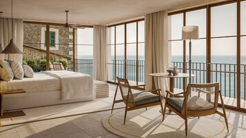 Suite Deluxe, terraza, vistas al mar | Ropa de cama de alta calidad, minibar, caja fuerte