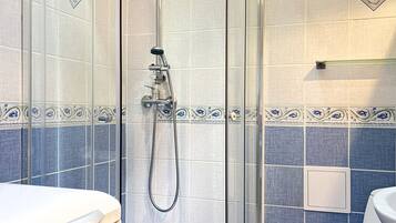 Shower, hair dryer, towels, toilet paper
